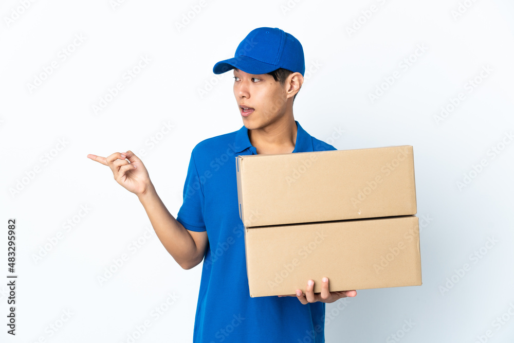 Delivery Chinese man isolated on white background intending to realizes the solution while lifting a finger up Delivery Chinese man isolated on white background intending to realizes the solution while lifting a finger up