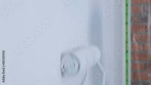 The painter applies decorative plaster