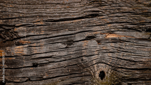 old wooden board with cracks and hole. Retro tamplate for background