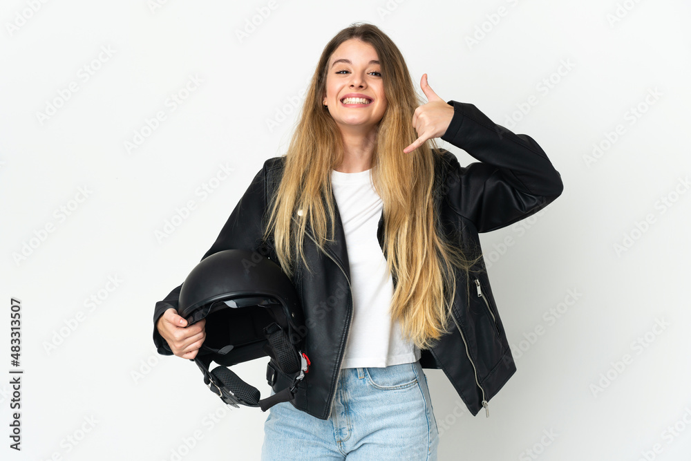 Woman holding a motorcycle helmet isolated on white background making phone gesture. Call me back sign Woman holding a motorcycle helmet isolated on white background making phone gesture. Call me back sign