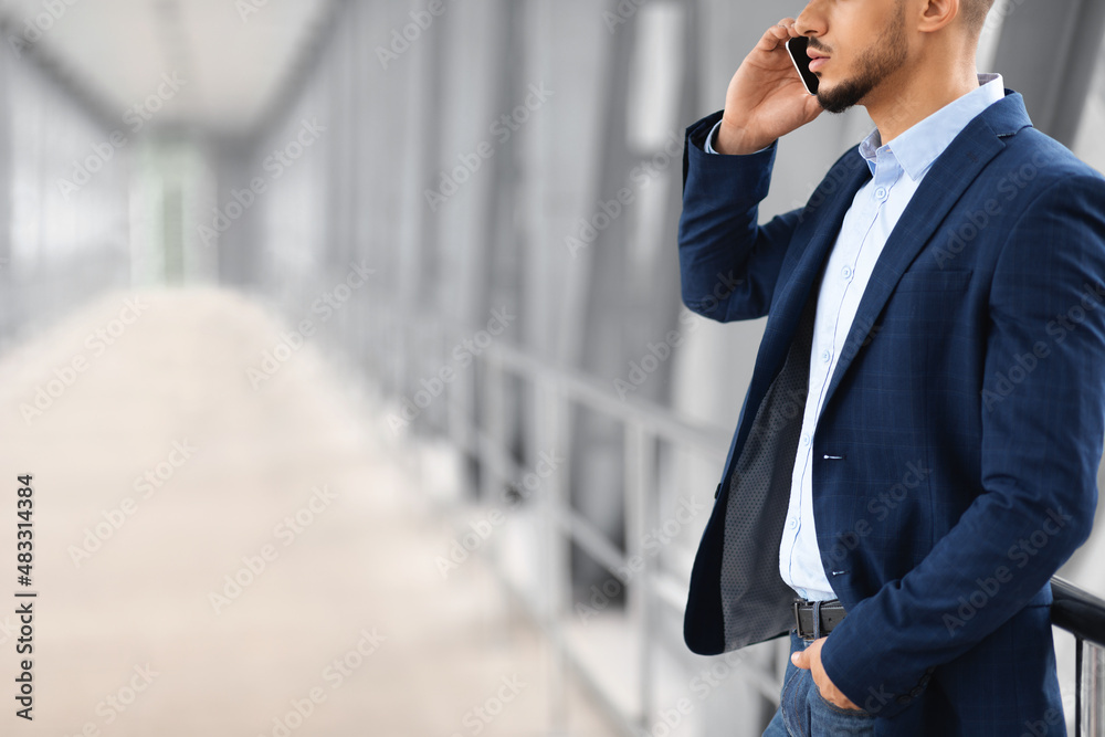 Mobile Call. Young Arab Businessman Talking On Cellphone At Airport Terminal Mobile Call. Young Arab Businessman Talking On Cellphone At Airport Terminal