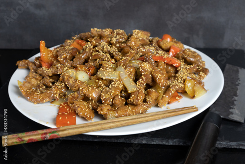 Bild auf Leinwand pork loin with sweet and sour sauce, asian recipe with chopsticks