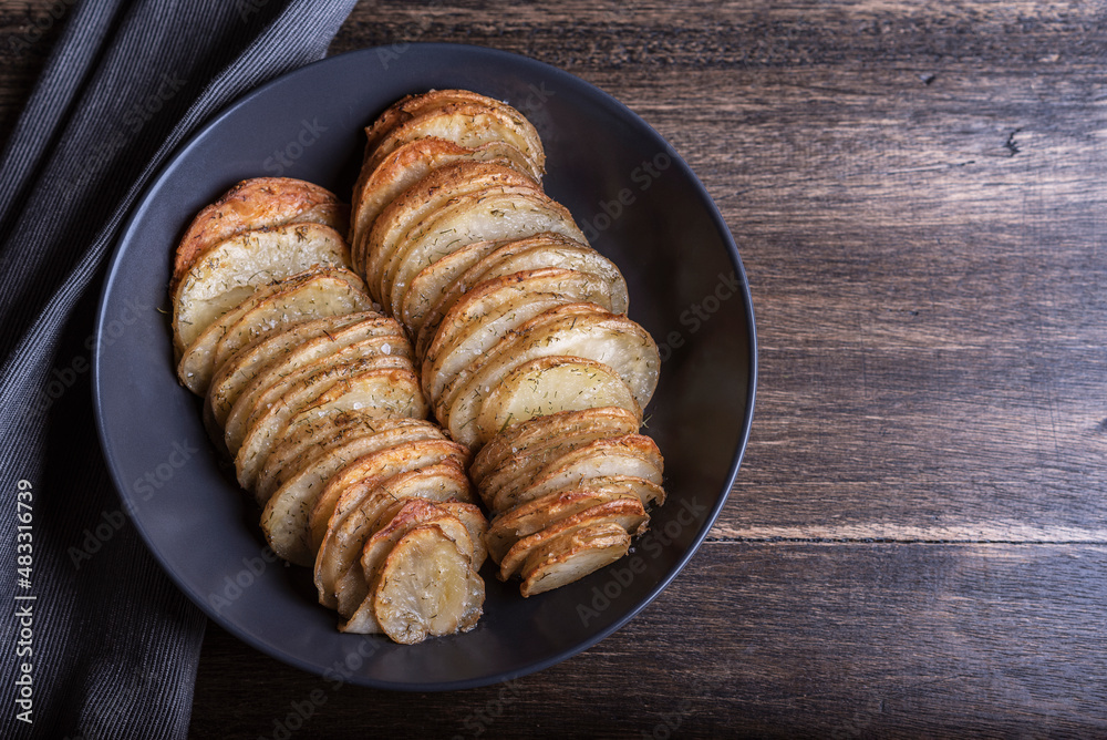 Baked potato recipe, on a wooden table Baked potato recipe, on a wooden table