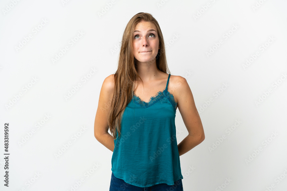 Young caucasian woman over isolated background and looking up Young caucasian woman over isolated background and looking up