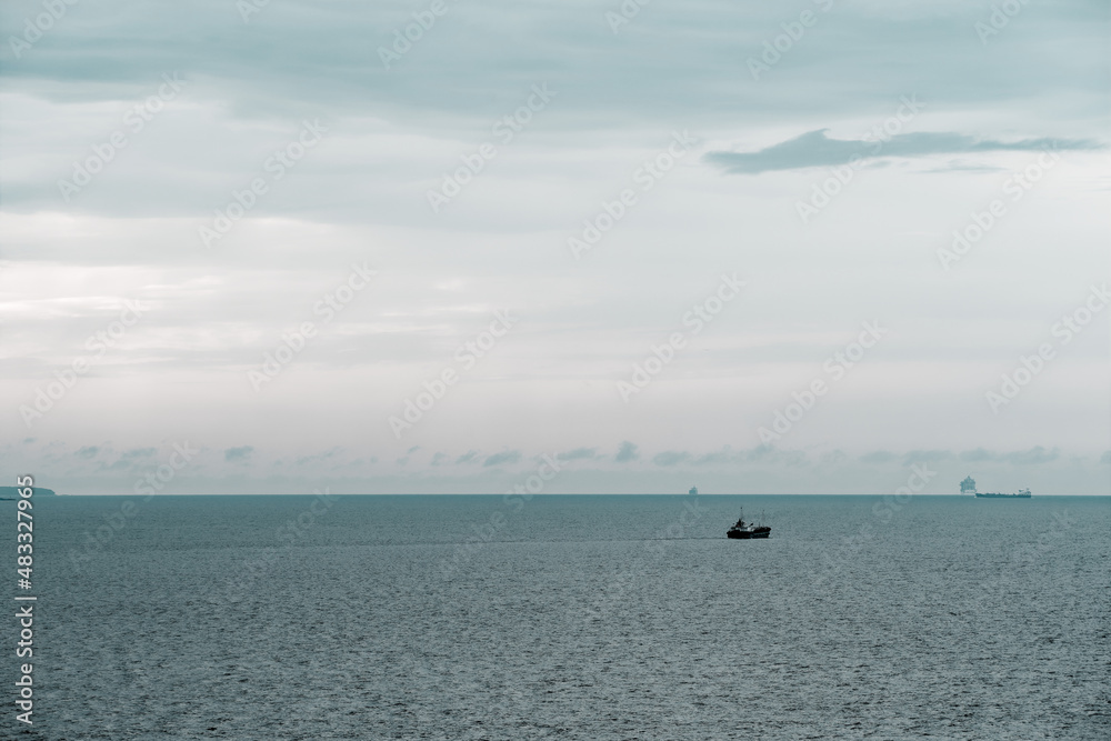 Panoramic view of sea and ship in vintage look