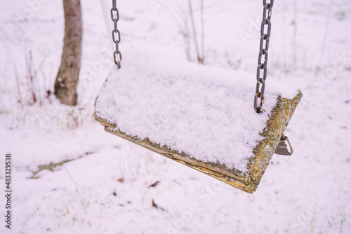 Empty swing in an deserted rural scene photo