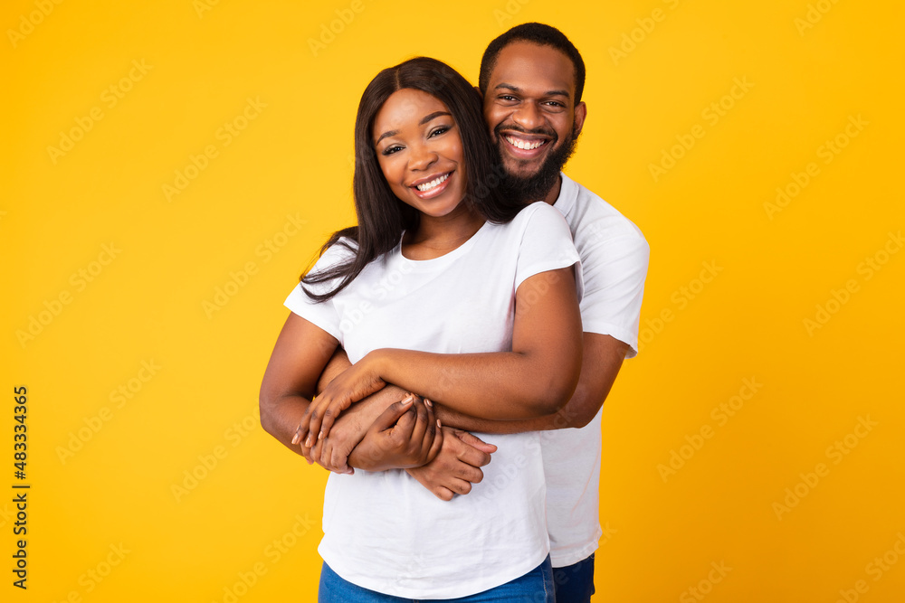 African American bearded man cuddling with his woman African American bearded man cuddling with his woman