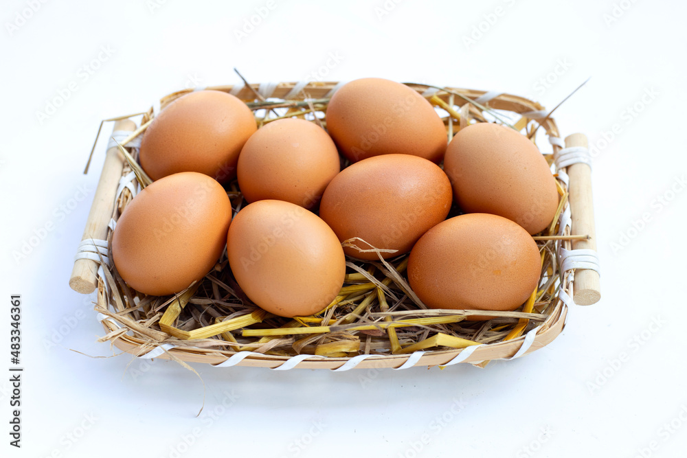 Fresh organic eggs in a straw nest Fresh organic eggs in a straw nest