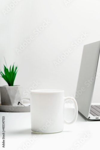 Wallpaper Mural White mug mockup on modern stylish workplace with laptop. Cup mockup. Torontodigital.ca