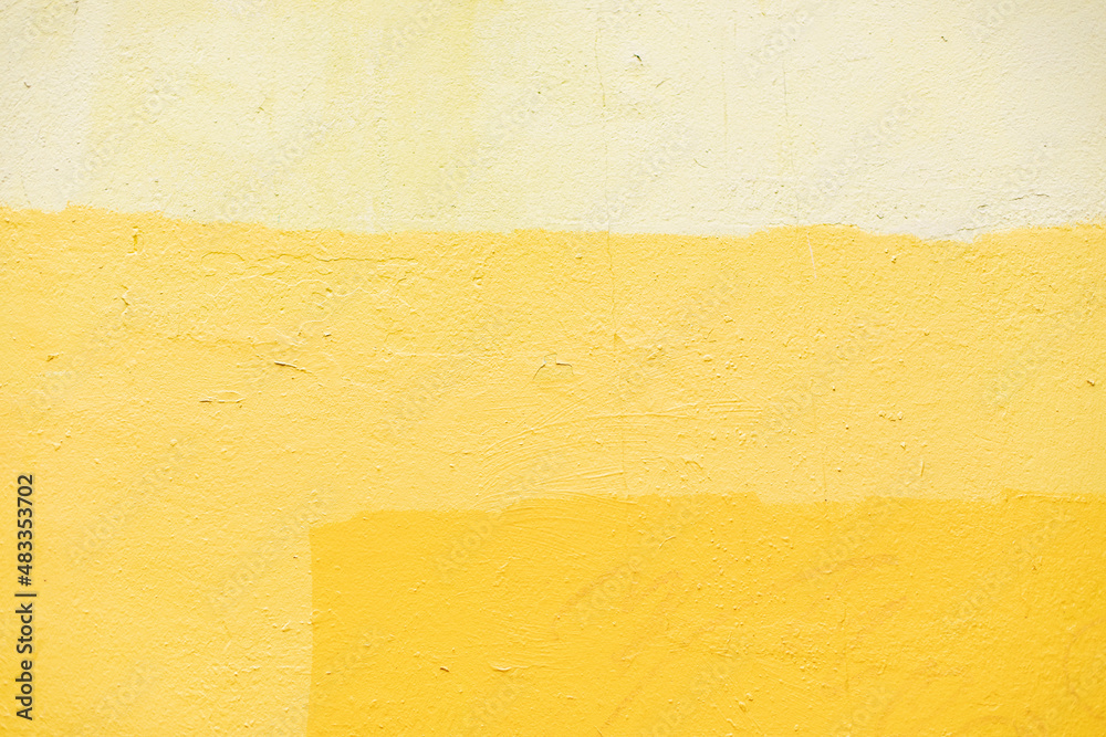 Naklejka premium Texture is yellow paint. Combination of yellow shades on wall. Surface of painted wall.