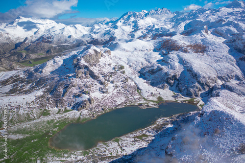 Lakes of Covadonga in Asturias with snowy mountains © elfarero