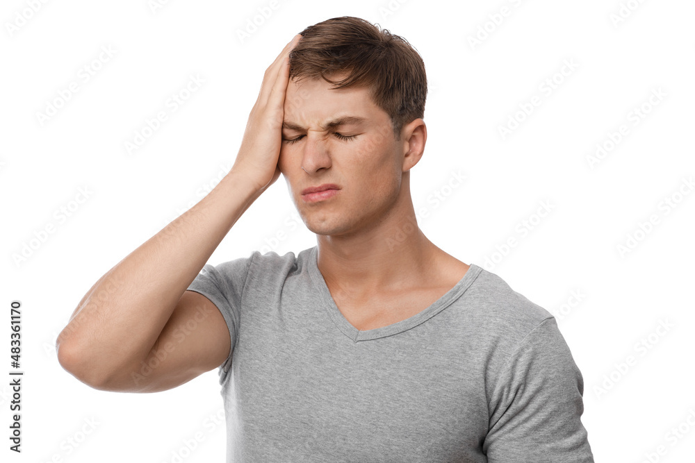 Upset frustration young european male suffering from migraine, feeling unwell, isolated on white background Upset frustration young european male suffering from migraine, feeling unwell, isolated on white background
