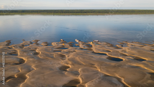 Beautiful sandy river bottom at low tide in northern Siberia on a sunny summer day