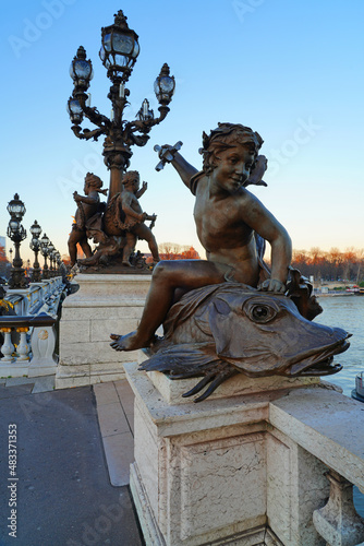 The landmark Pont Alexandre III bridge over the River Seine in Paris, connecting the Invalides area to the Champs-Elysees neighborhood. photo