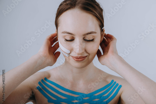 Tableau sur toile girl with kinesio taping on her face and chest