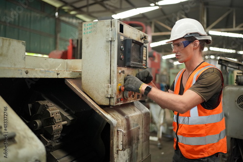 Industrial Engineers in Hard Hats.Work at the Heavy Industry Manufacturing Factory.industrial worker indoors in factory. man working in an industrial factory.