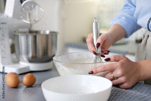 Fototapeta Naklejka Na Ścianę i Meble -  Preparation of the test. Ingredients on the table-wheat flour, eggs, salt. Mixer.