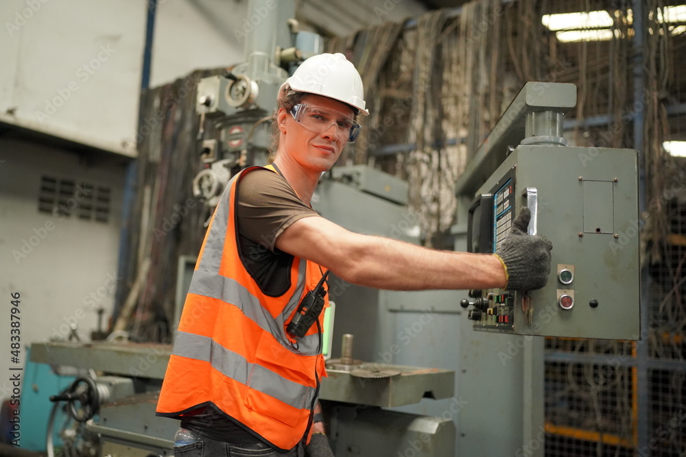 Industrial Engineers in Hard Hats.Work at the Heavy Industry Manufacturing Factory.industrial worker indoors in factory. man working in an industrial factory.