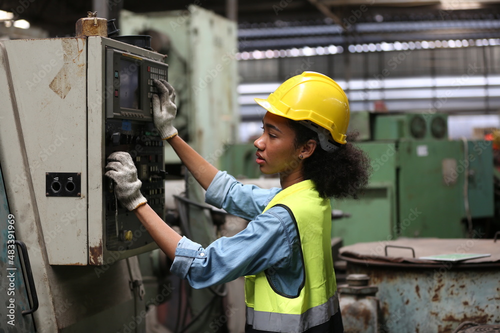 Industrial Engineers in Hard Hats.Work at the Heavy Industry Manufacturing Factory.industrial worker indoors in factory. man working in an industrial factory.