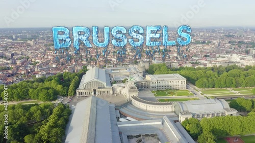 Inscription on video. Brussels, Belgium. Park of the Fiftieth Anniversary. Park Senkantoner. The Arc de Triomphe of Brussels (Brussels Gate). Arises from blue water, Aerial View photo