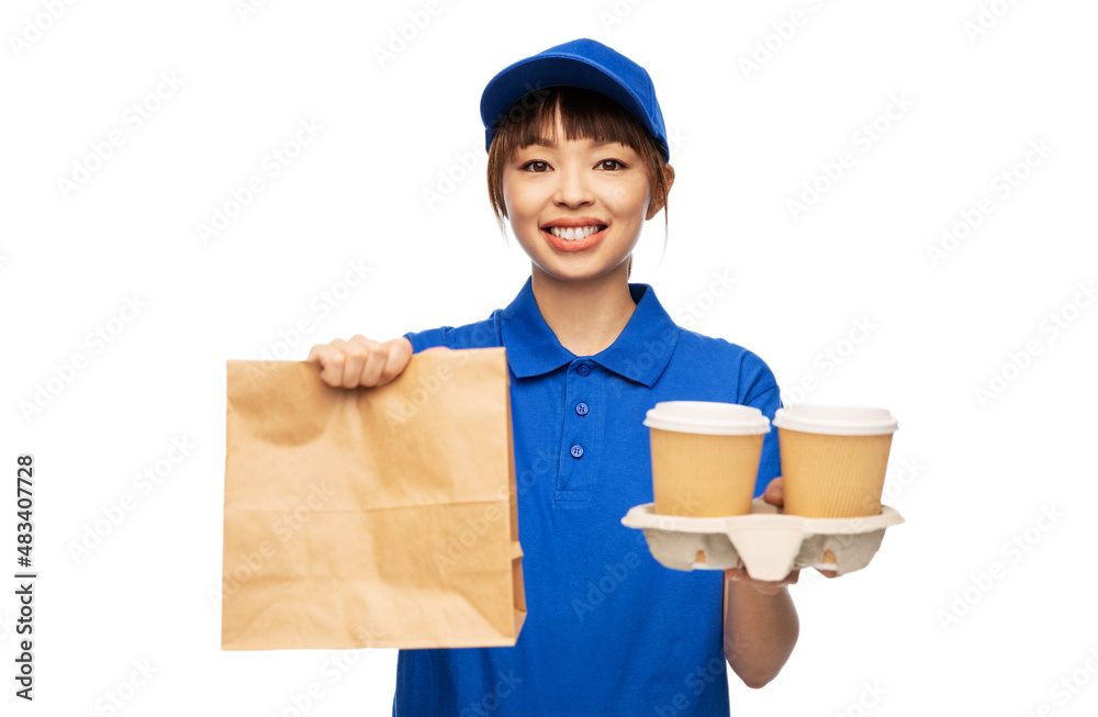 service and job concept - delivery girl in blue uniform with takeaway food in paper bag and hot drinks in disposable coffee cups over white background service and job concept - delivery girl in blue uniform with takeaway food in paper bag and hot drinks in disposable coffee cups over white background