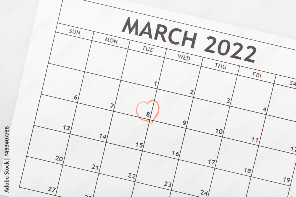 top view of march 2022 calendar with drawn heart around 8 march date