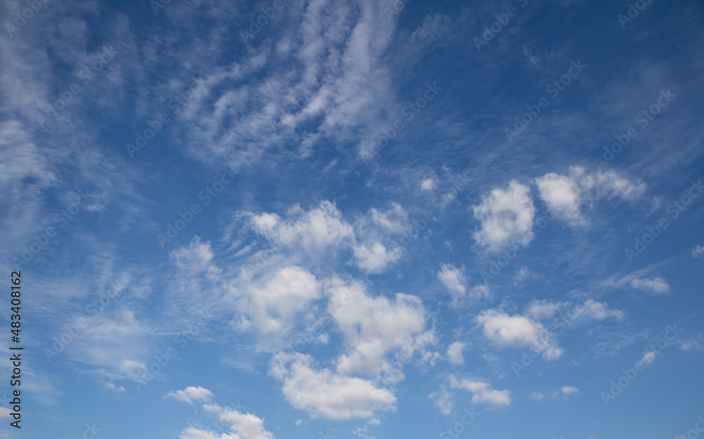 blue sky with white fluffy clouds for Background.