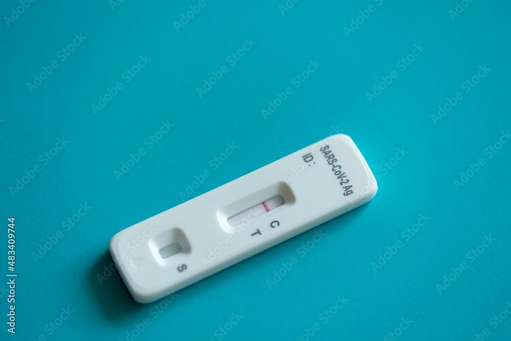 Rapid antigen coronavirus test on the blue background Rapid antigen coronavirus test on the blue background