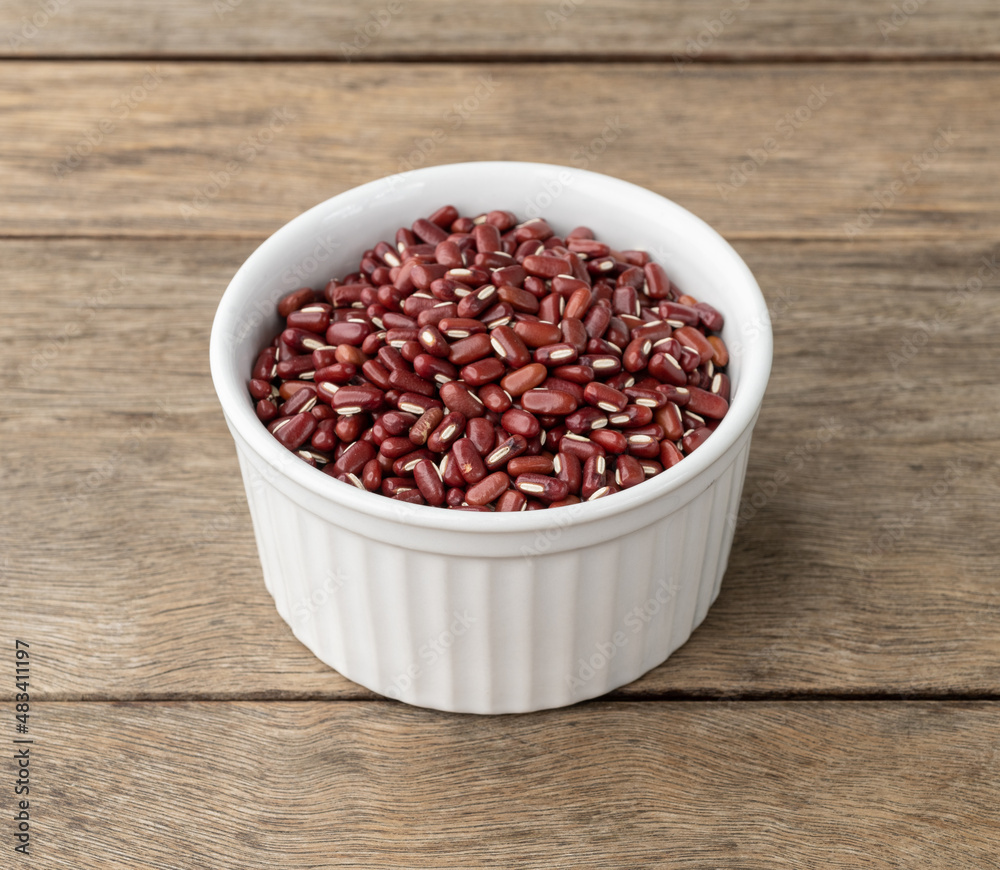 Azuki beans in a bowl over wooden table Azuki beans in a bowl over wooden table