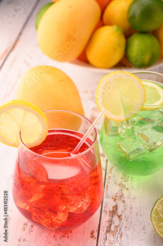 Multicolorful mocktails with ice. Strawberry mocktail and lime mocktail