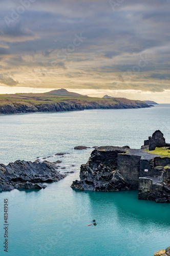 SCUBA Divers at the Blue Lagoon in Wales, UK with a moody, dusk background sky photo