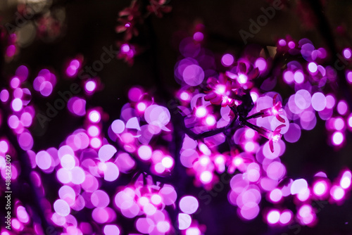 Abstract image out of focus lights in the city or Night Light pink tone
