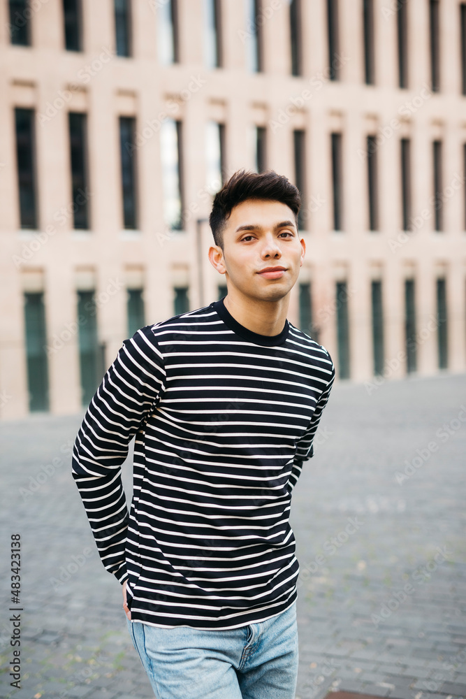 Portrait of a young male walking on the street Portrait of a young male walking on the street