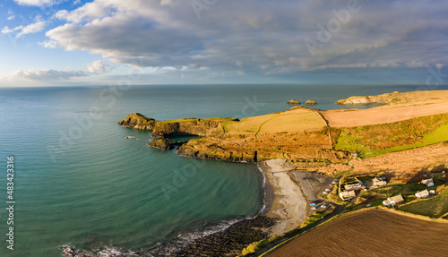 Aerial view of the Welsh seaside village of Abereiddy in a sunny, winters day