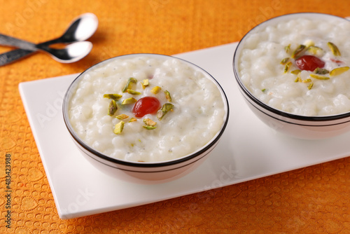 Sabudana Kheer thick pudding with tapioca pearls sago dessert from cassava root Indian sweet mithai  chowari payasam for Mahashivratri Ram Navami Diwali festival. photo