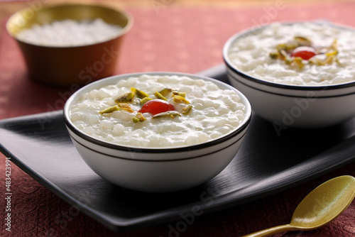 Sabudana Kheer thick pudding with tapioca pearls sago dessert from cassava root Indian sweet mithai  chowari payasam for Mahashivratri Ram Navami Diwali festival. photo