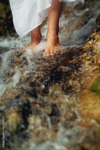 beautiful woman feet in water.
