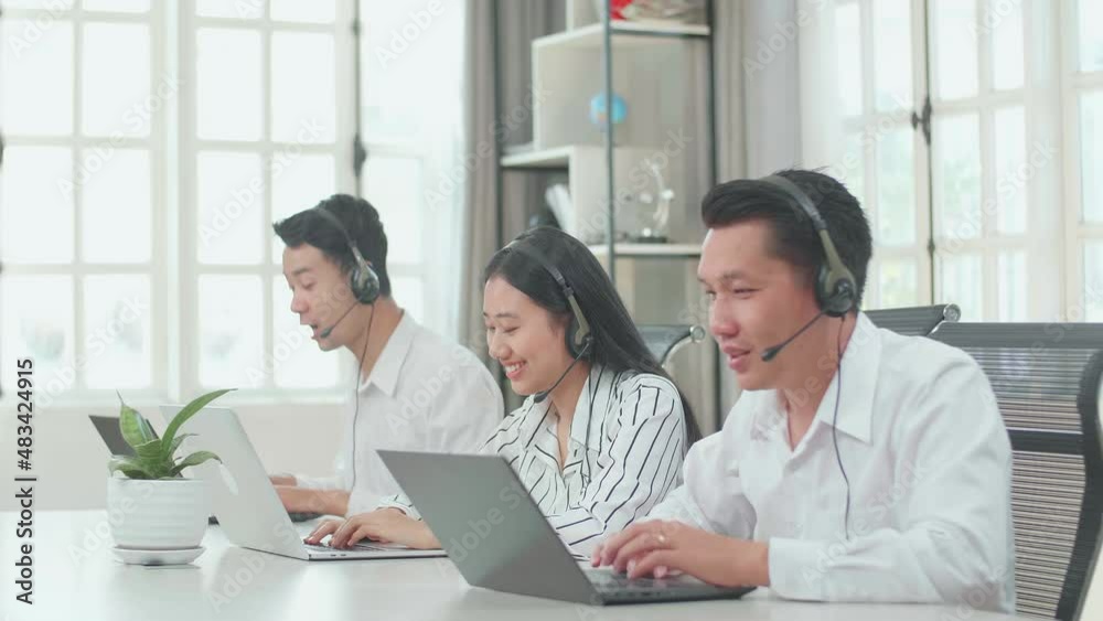 Three Asian Call Center Agents Wearing Headsets And Typing On Computer While Speaking To Customers On The Call At The Office
Three Asian Call Center Agents Wearing Headsets And Typing On Computer While Speaking To Customers On The Call At The Office
