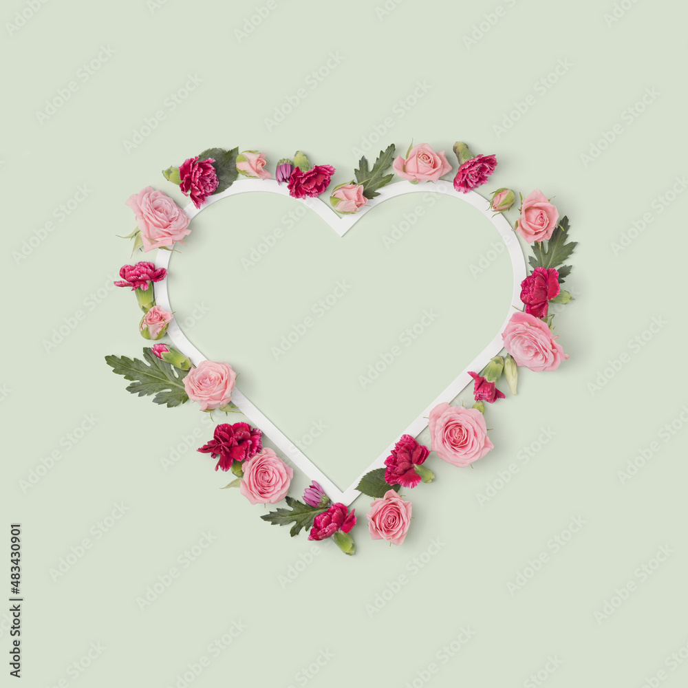 Valentine's day romantic heart shaped frame with flowers. Mother's day floral background