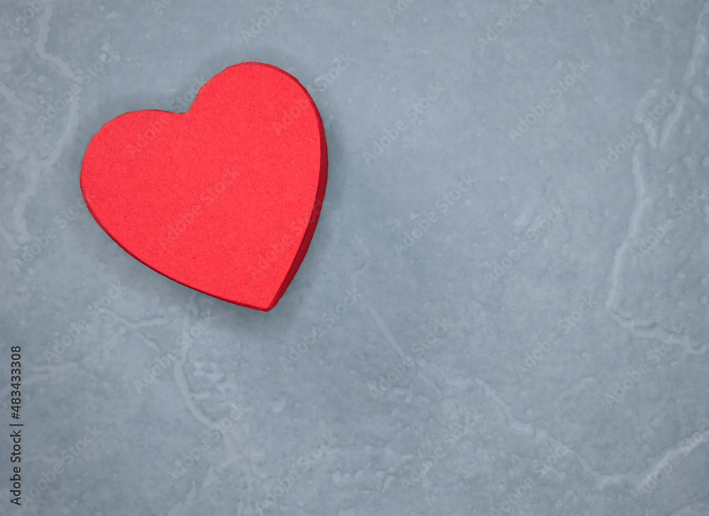 red heart on a light grey background shot from above no people red heart on a light grey background shot from above no people