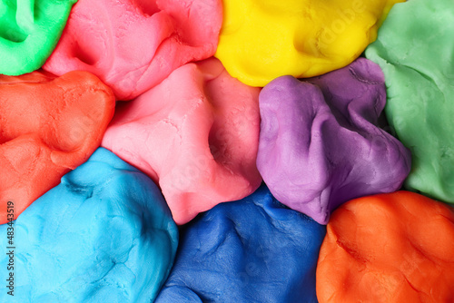 Fototapet Different color play dough as background, top view