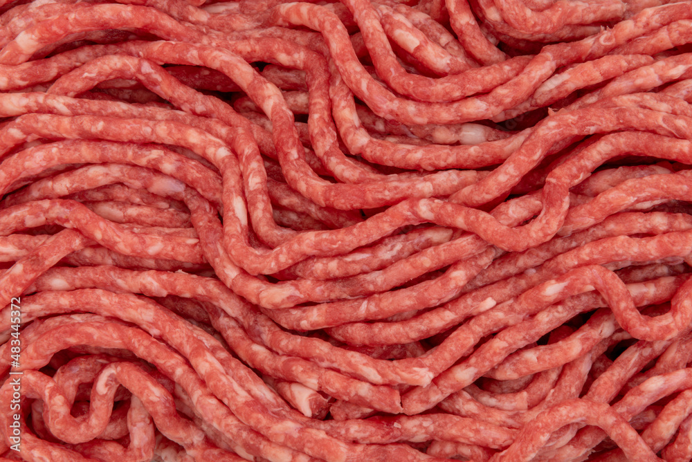 Beef mince meat texture background, raw minced meat in close-up in top view Beef mince meat texture background, raw minced meat in close-up in top view