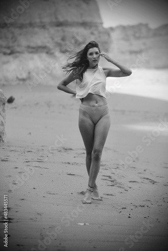 woman on the beach in lagos algarve portugal 