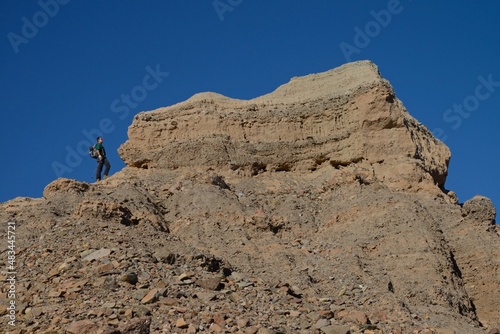 Man climbing hill, Mojave Desert, California, USA, MR