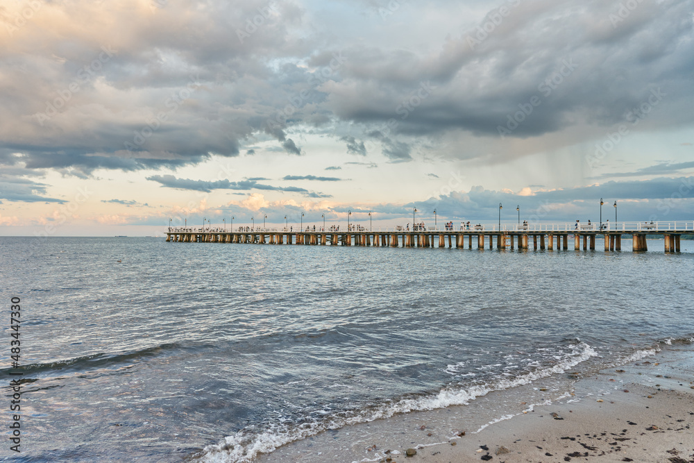 Beautiful landscape with wooden pier in Gdynia Orlowo in background. Baltic Sea Poland     