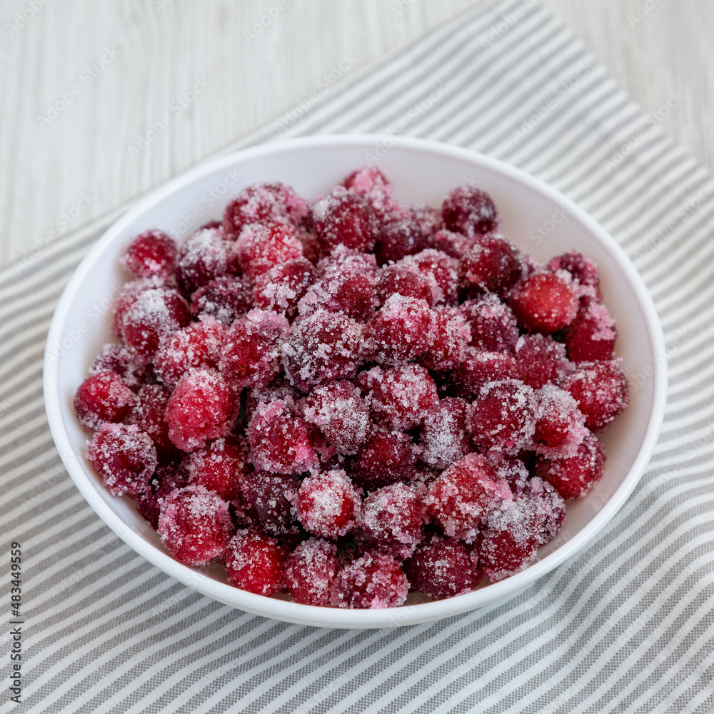 Red Sugared Cranberries in a Bowl, side view. Red Sugared Cranberries in a Bowl, side view.