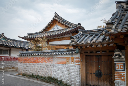 Traditional Korean residential house with roof tiles at Bukchon Hanok Village in Seoul, South Korea.