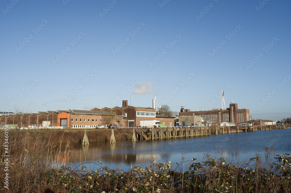 Cityscape of a industrial area with factories and industrial chimneys in Arnhem in the Netherlands