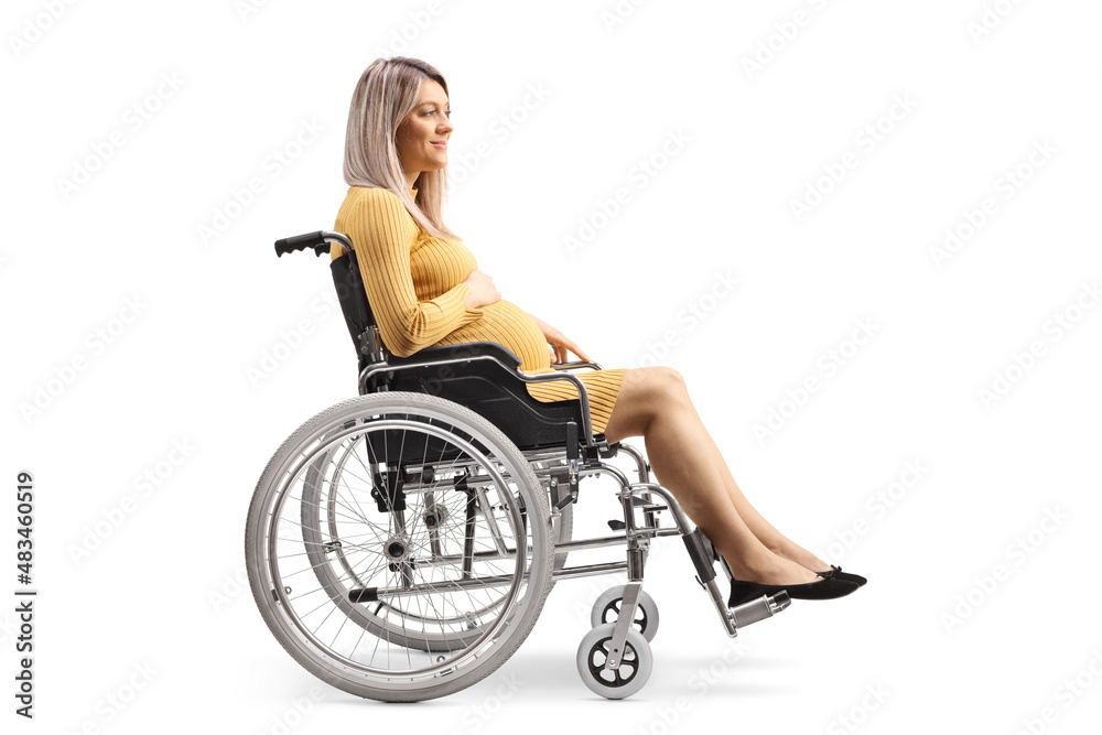 Full length profile shot of a pregnant woman sitting in a wheelchair Full length profile shot of a pregnant woman sitting in a wheelchair