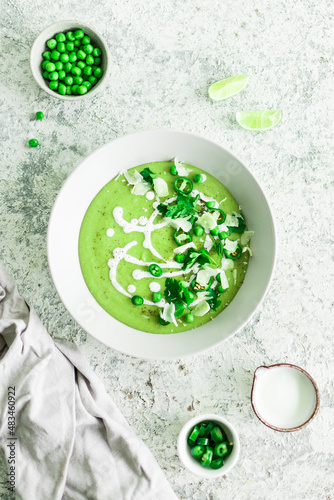 Green pea cream soup with parsley and lime